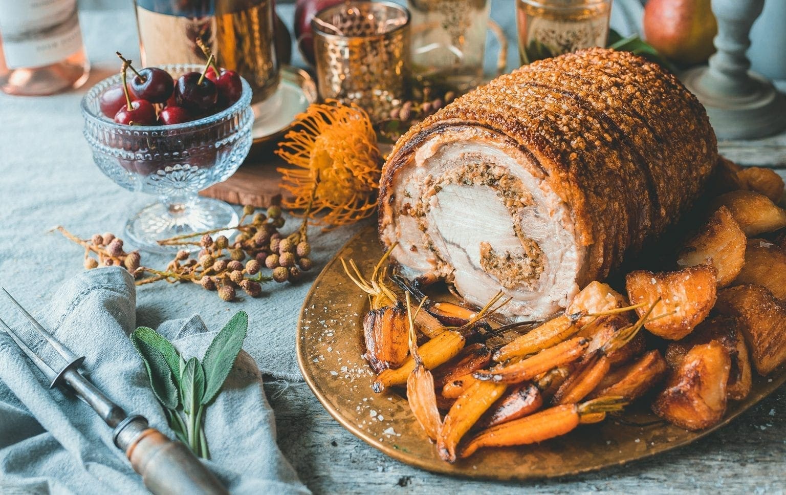 Deboned and stuffed rolled pork loin roast with roast potatoes • SA Pork