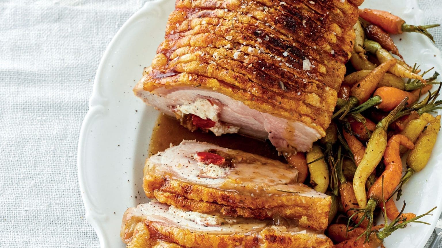 Deboned and stuffed rolled pork loin roast with roast potatoes SA